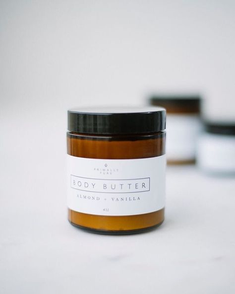 a small jar with primally pure body butter against a white background