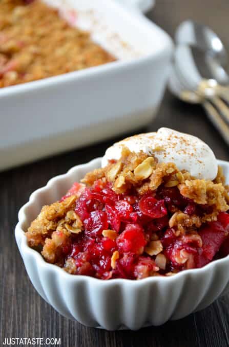 Thanksgiving leftover cranberry and apple crisp served with ice cream in a white bowl