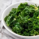 Sauteed kale served in a white bowl