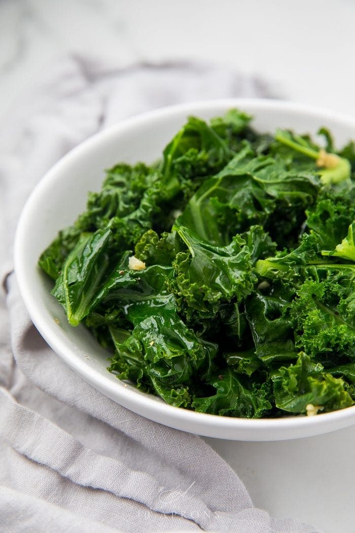 Sauteed kale served in a white bowl