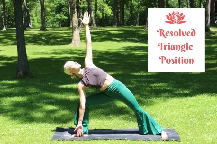 a blonde woman practicing detox yoga in a park 