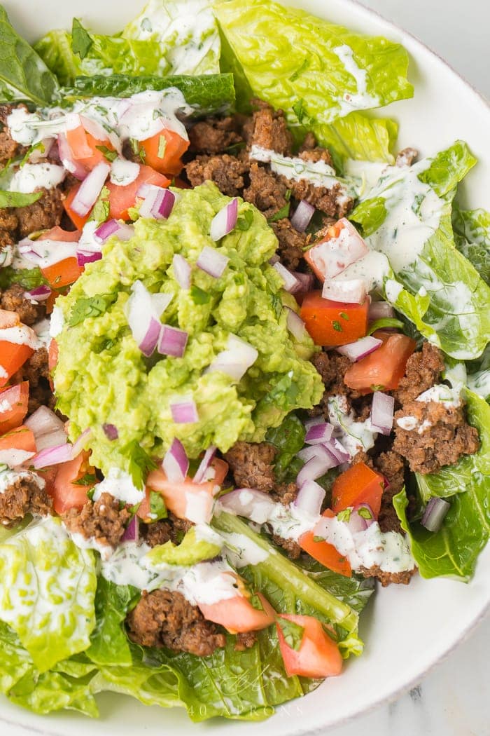 Healthy taco salad served in a white bowl