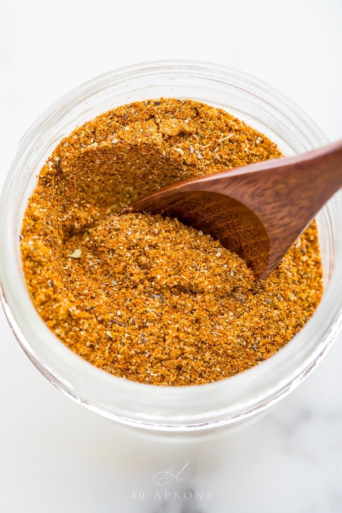 A small wooden spoon in the spice mix