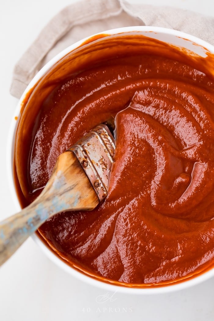 The finished whole30 bbq sauce in a bowl with a brush