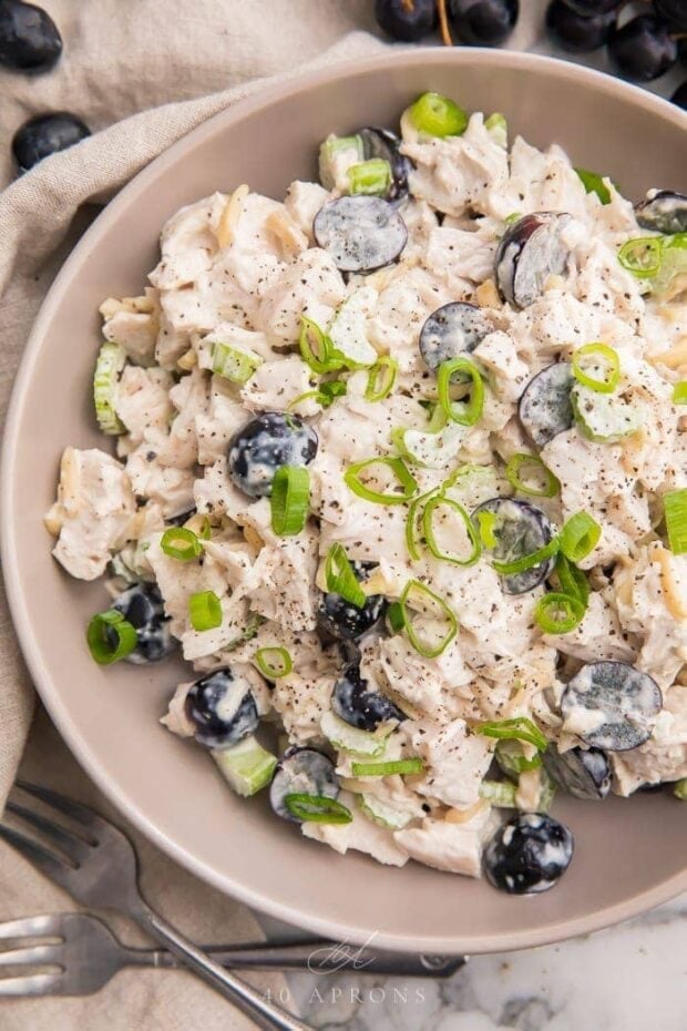 Whole30 chicken salad in a grey bowl with grapes