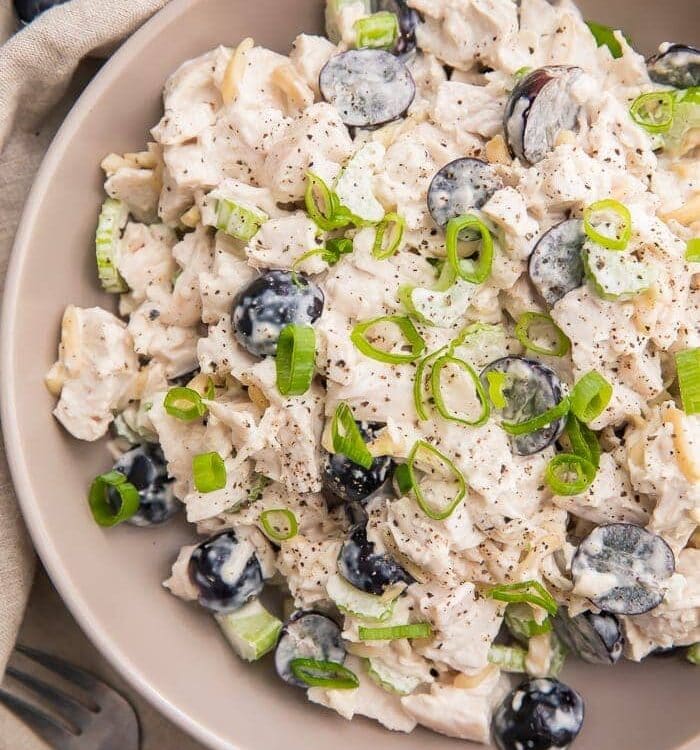 Whole30 chicken salad in a grey bowl with grapes