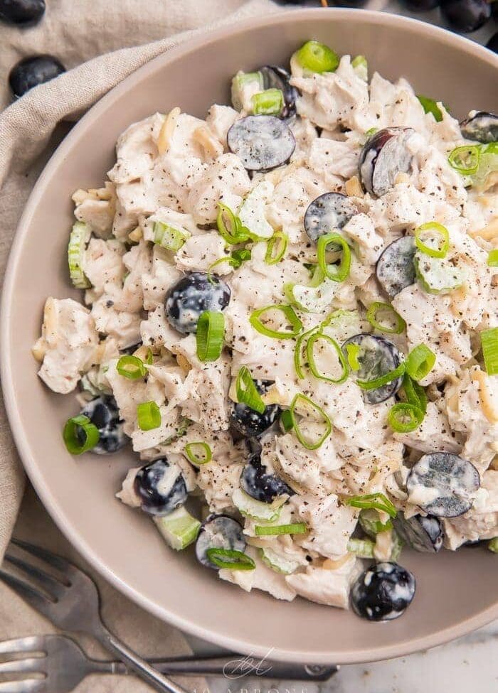 Whole30 chicken salad in a grey bowl with grapes