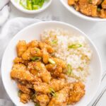 Whole30 sesame chicken over cauliflower rice in a bowl