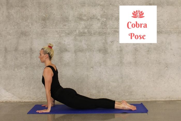 a blond woman demonstrating the cobra pose as an example of yoga poses for stress relief