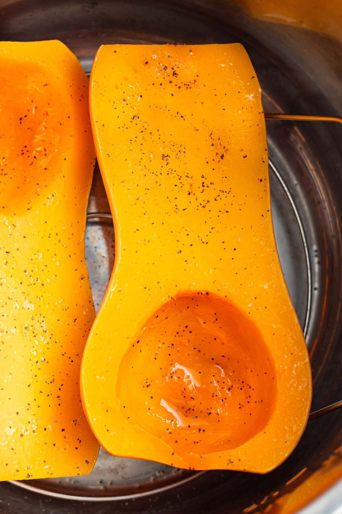 Butternut squash halves cooked in an Instant Pot.