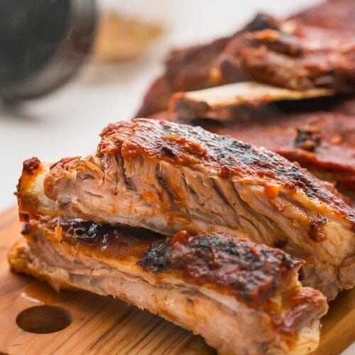 Close up of baby back ribs on a chopping board