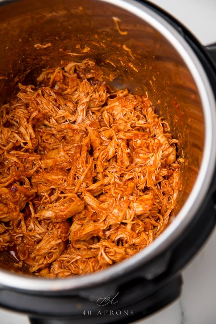 The bbq chicken shredded in an instant pot ready to serve