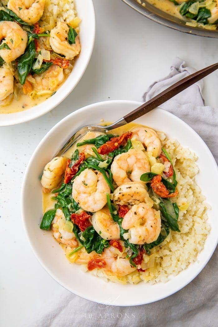 Close up of a bowl of Tuscan shrimp