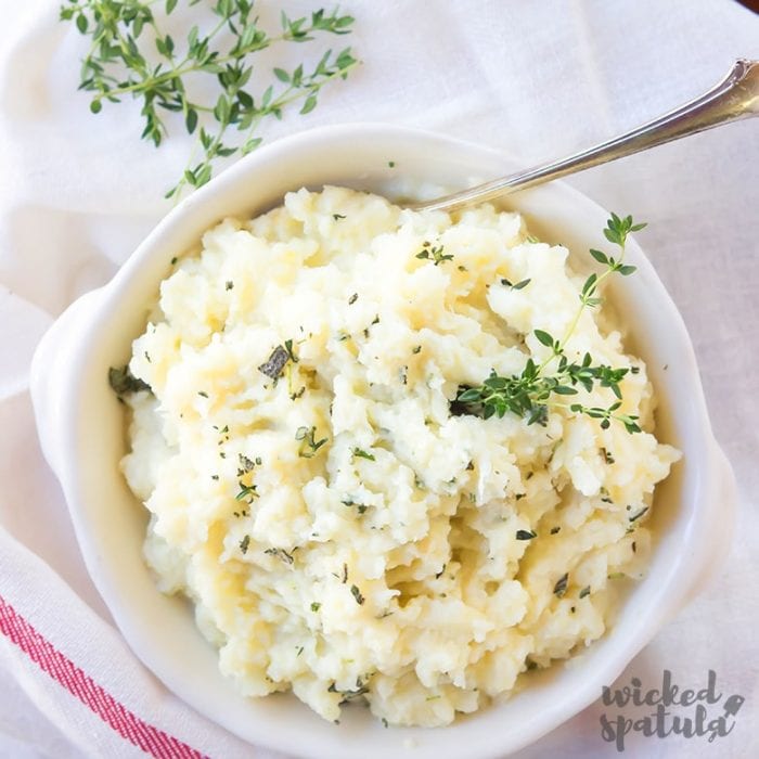 Slow cooker cauliflower mash in a white bowl