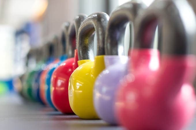 colorful row of kettlebells 