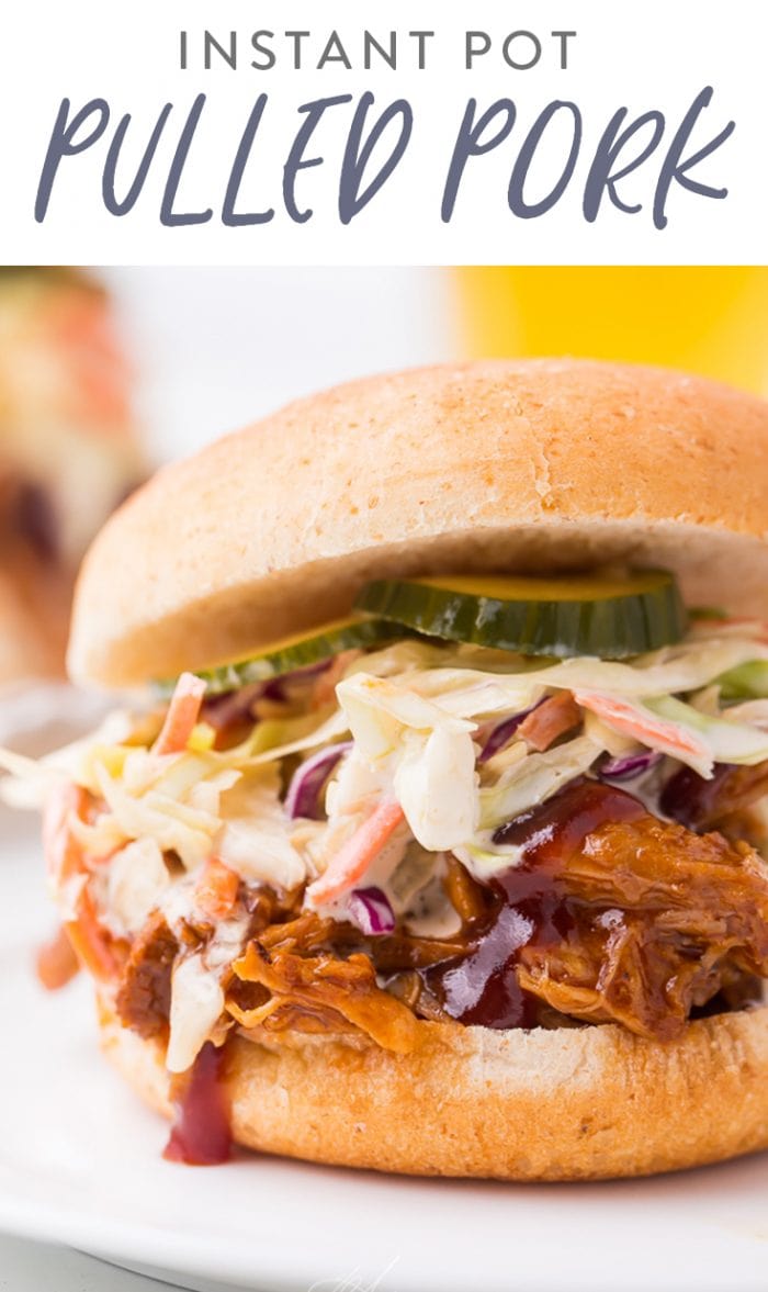 pinterest image of instant pot pulled pork served on hamburger buns with coleslaw, barbecue sauce, and pickles.