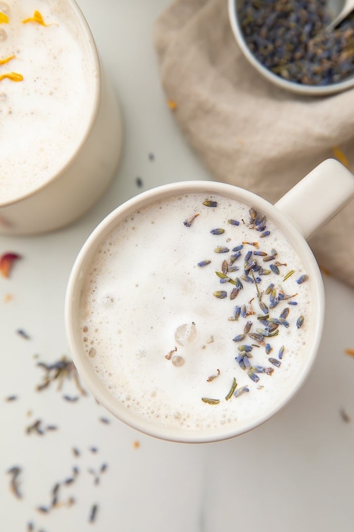 Lavendar moon milk in a white mug