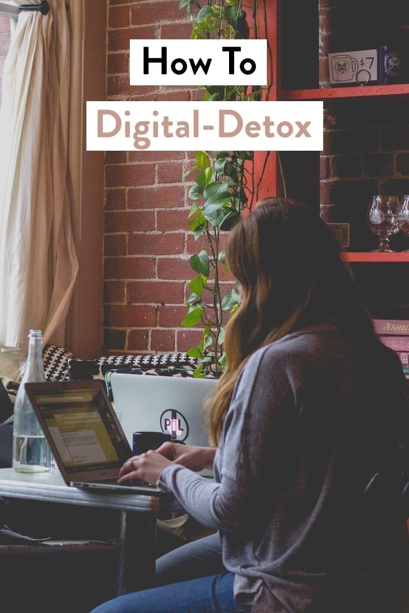 Woman sitting at a laptop in a cafe