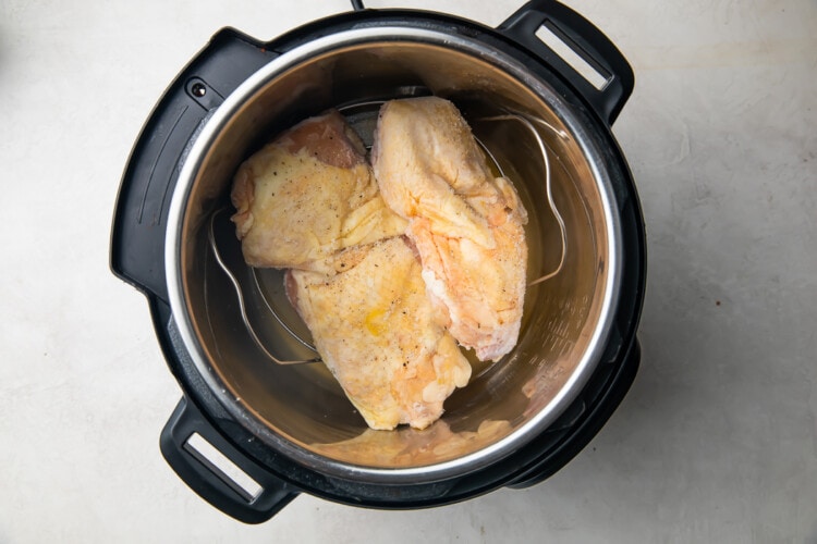 Uncooked chicken thighs in an Instant Pot