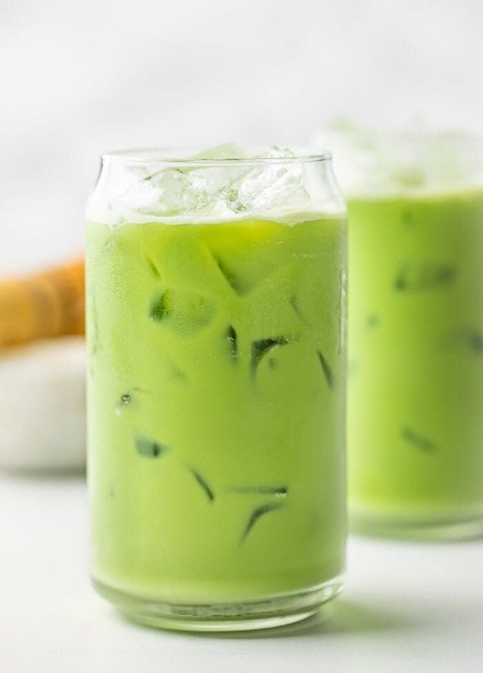 Two glasses of iced matcha latte