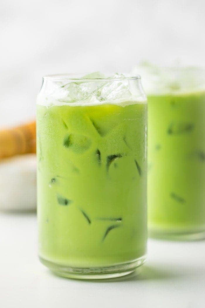 Two glasses of iced matcha latte