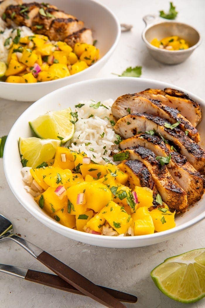 Bowl of jerk chicken with coconut rice and mango salsa