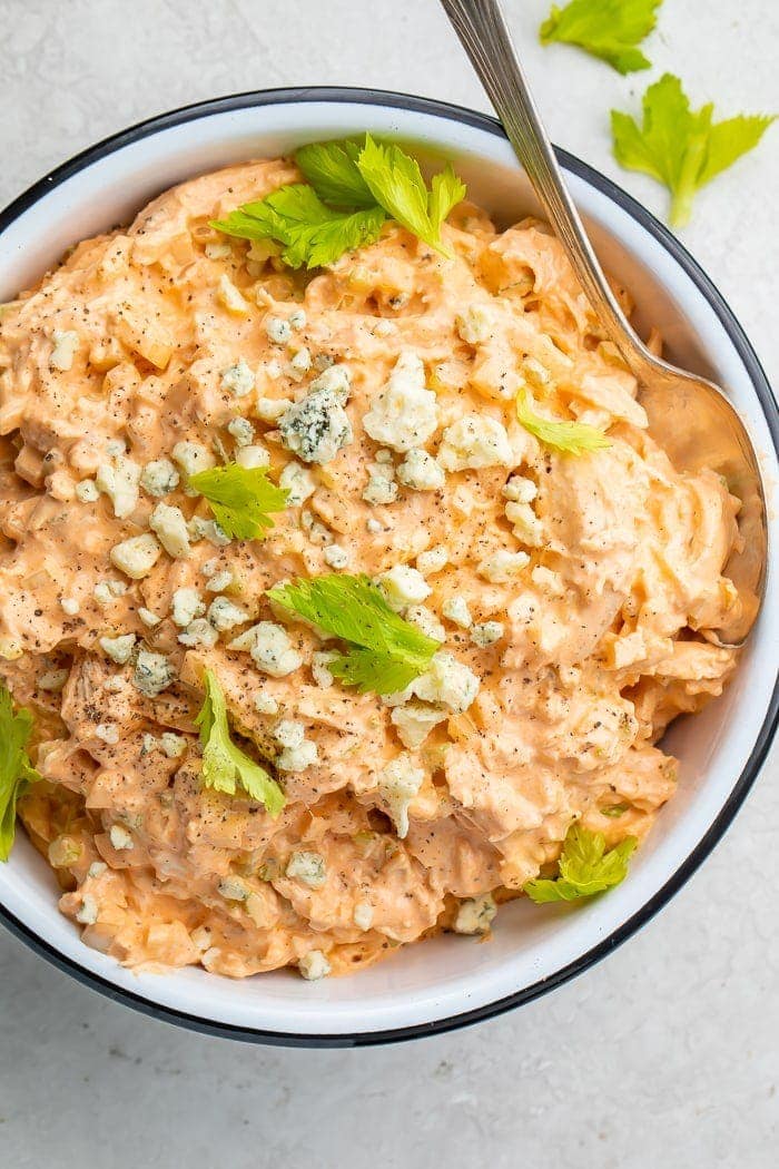 Buffalo chicken salad in a bowl with a spoon