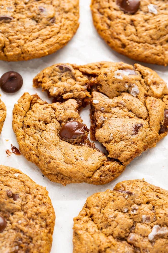 Paleo chocolate chip cookie with gooey chocolate chips broken in half