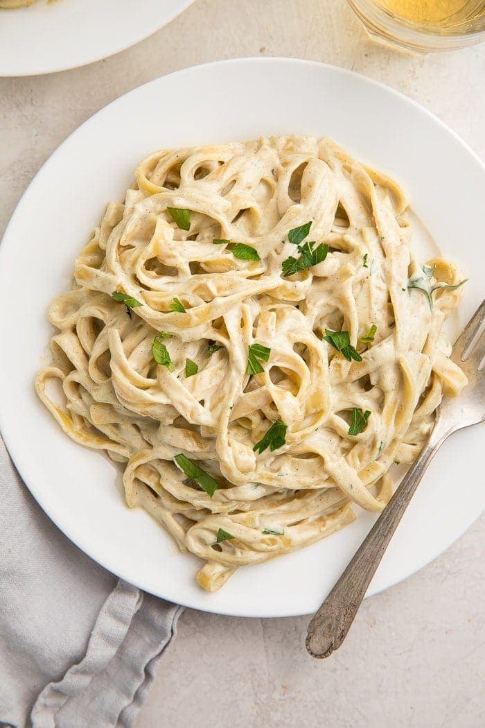 Overhead of pasta with vegan alfredo sauce on a plate