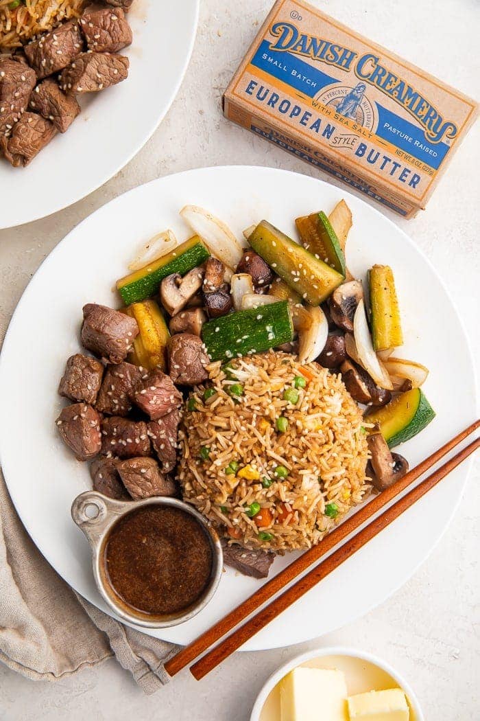 Hibachi steak with fried rice and vegetables on a plate