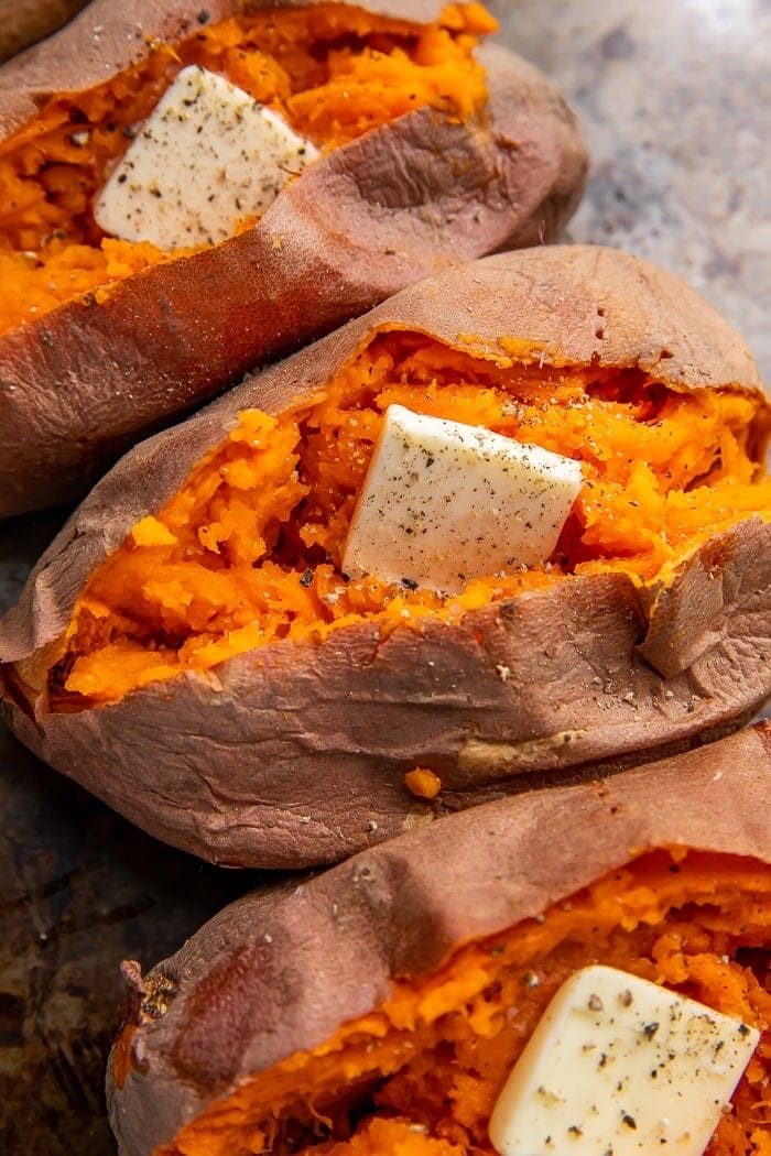 Microwave sweet potatoes with butter and seasonings