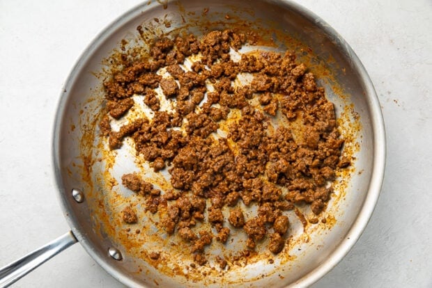 Ground beef being cooked in a skillet