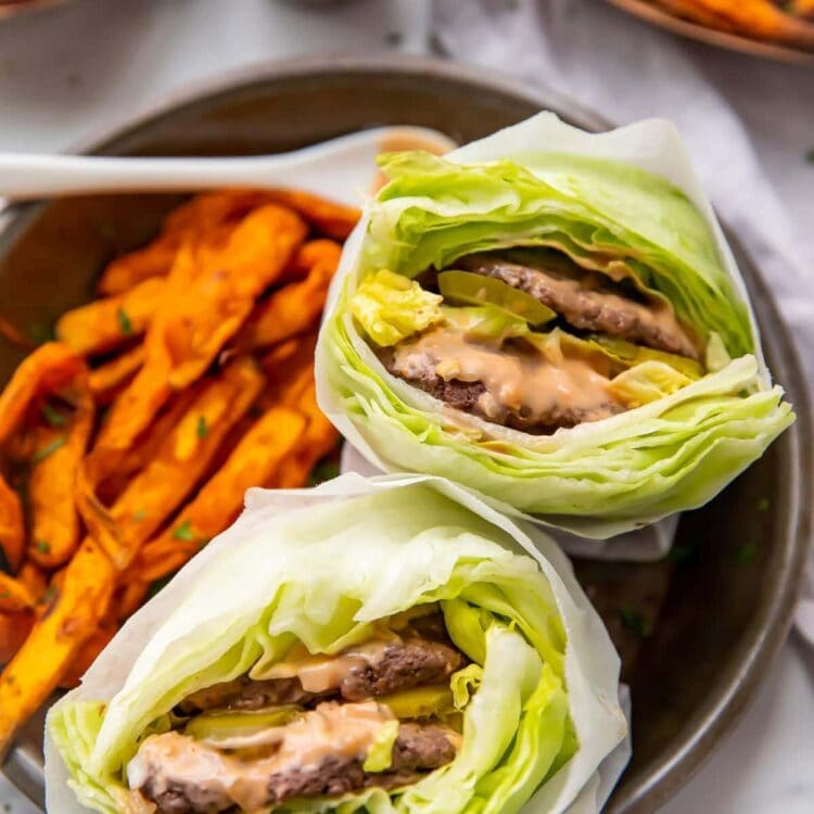 Two lettuce wrapped big macs with sweet potato fries