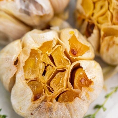 Close-up of roasted garlic on a sheet of aluminum foil