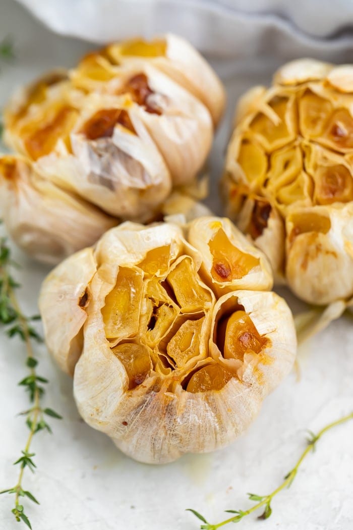 Close-up of roasted garlic on a sheet of aluminum foil