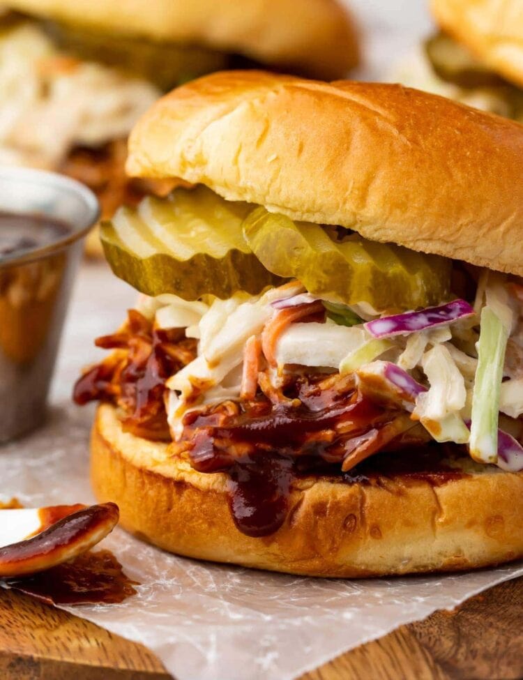 Sandwich with Instant Pot BBQ chicken topped with coleslaw