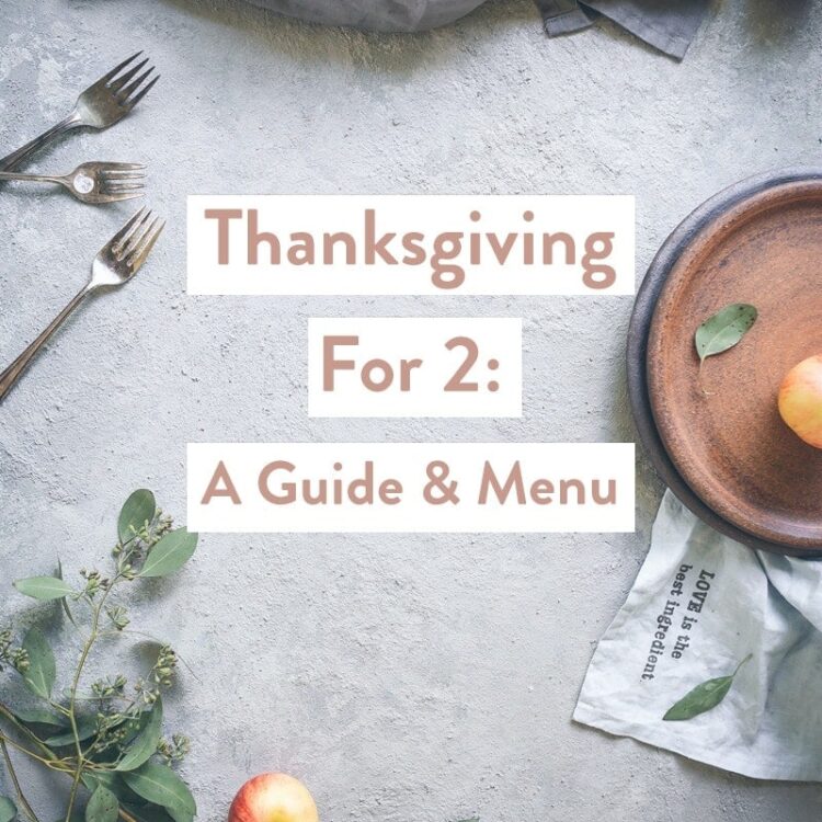 A tablescape with Thanksgiving foods with the text Thanksgiving For 2: A Guide & Menu