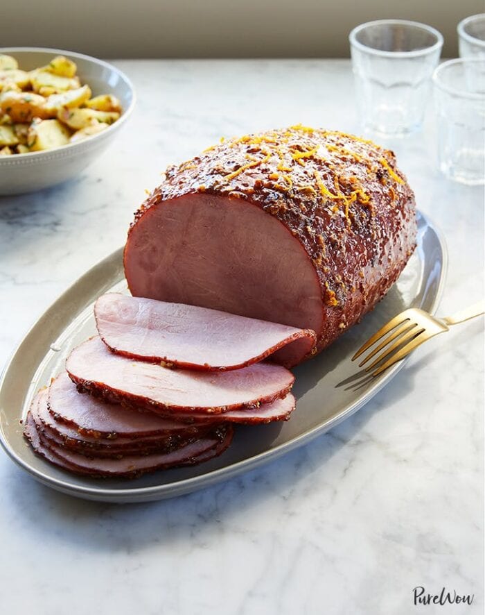 Sliced whole ham on a platter