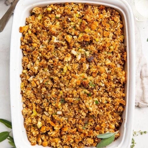 Overhead photo of a white casserole dish with Thanksgiving sausage stuffing