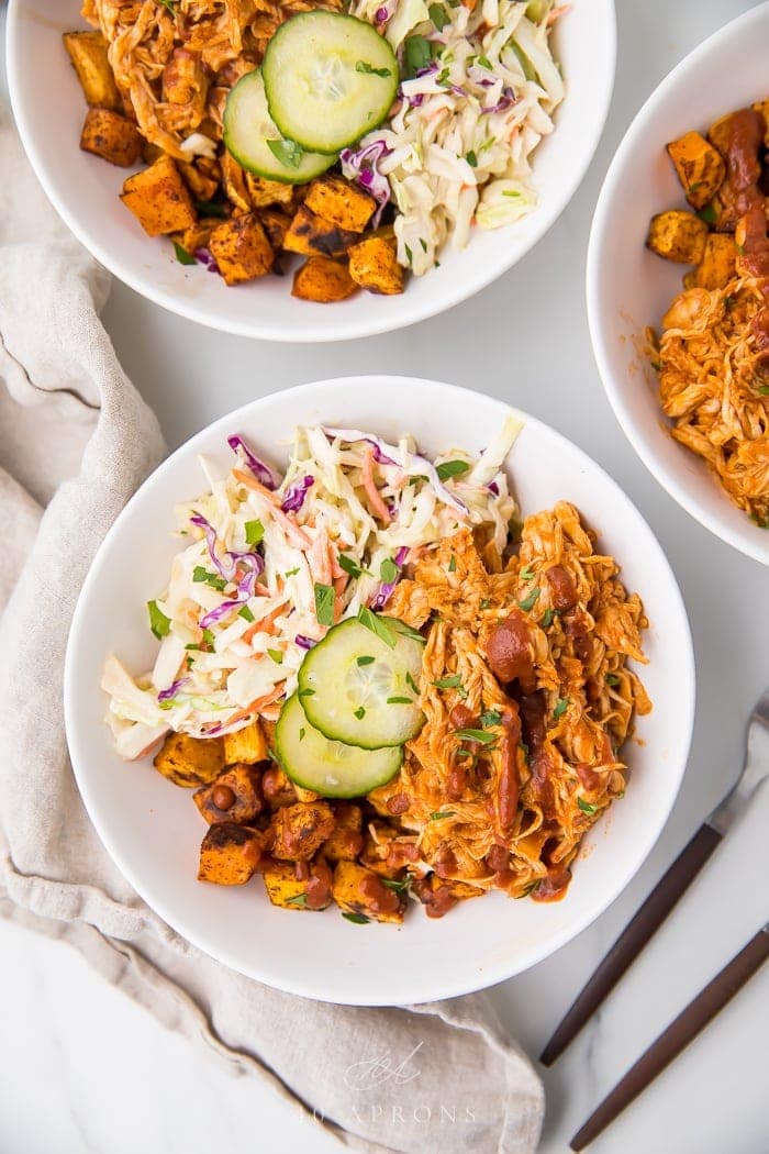 Whole30 bbq chicken bowl with sweet potatoes and coleslaw