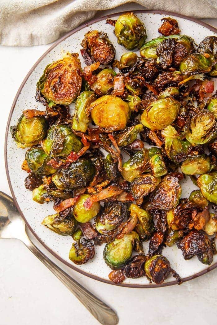 Lifestyle photo of a plate full of brussels sprouts and bacon