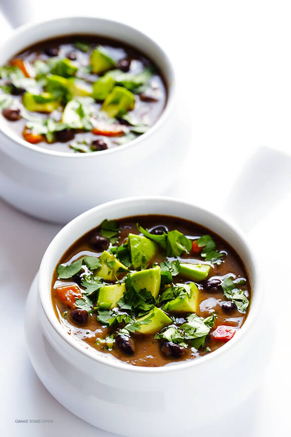 White bowls containing vegetarian slow cooker black bean soup
