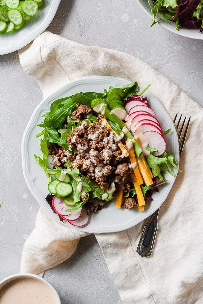 Plated korean beef salad with ground beef and sriracha ranch