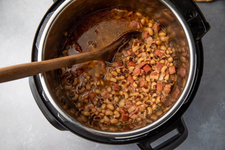 Instant pot black eyed peas with wooden spoon