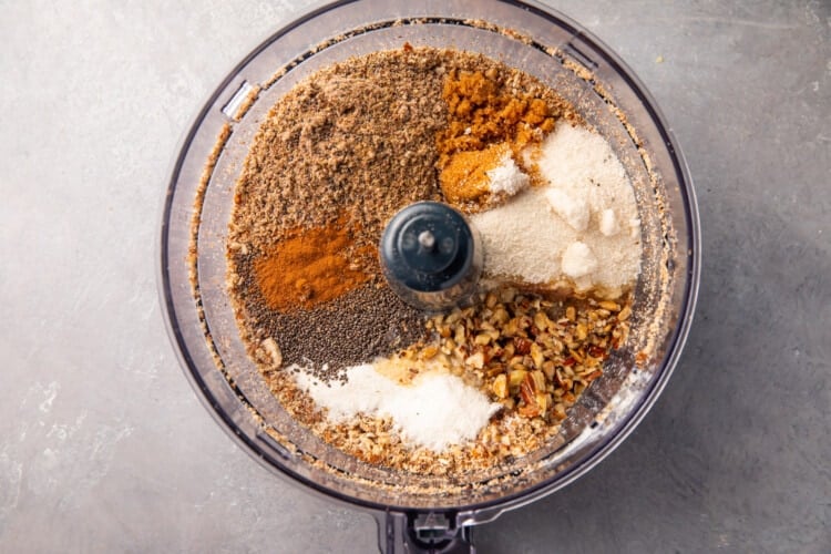 Nuts and seasonings for keto granola in a food processor bowl