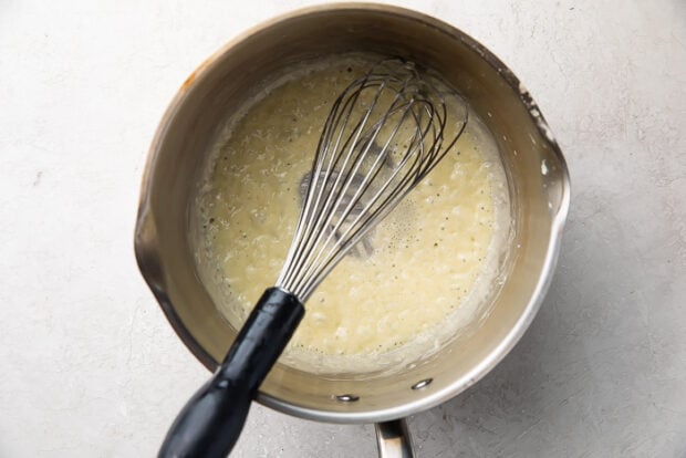 Fat and arrowroot powder in a medium saucepan with a whisk