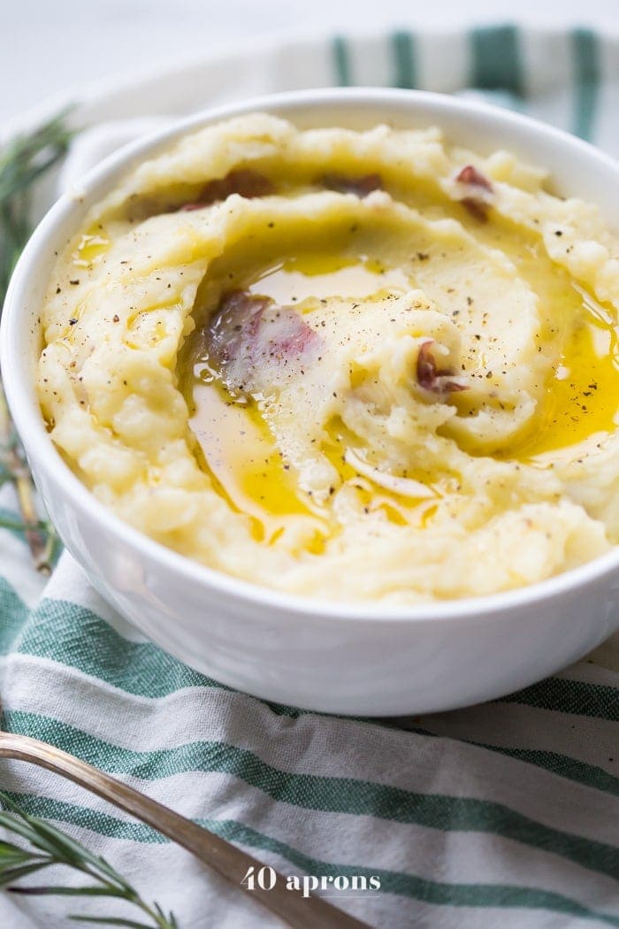 Swirled garlic butter Instant Pot mashed potatoes on a striped dishcloth