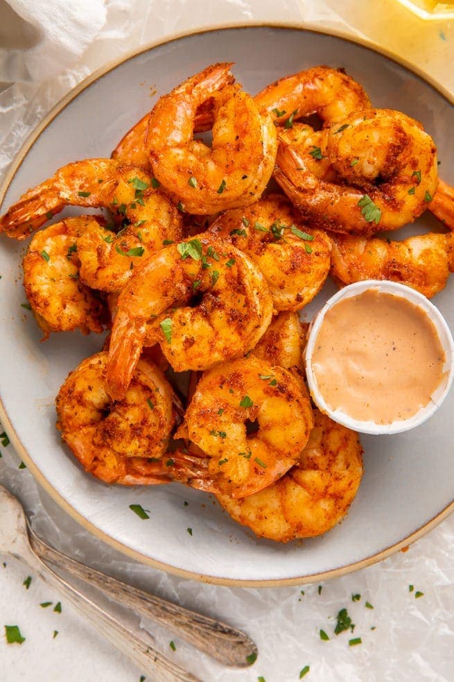 A plate of air fryer shrimp with comeback sauce