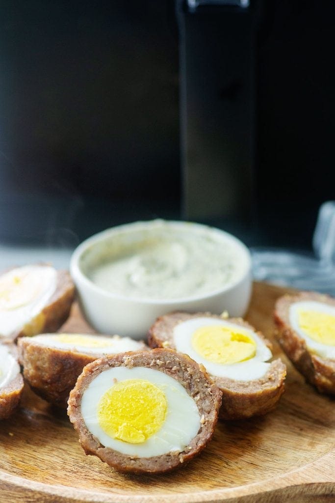 Scotch eggs on a cutting board