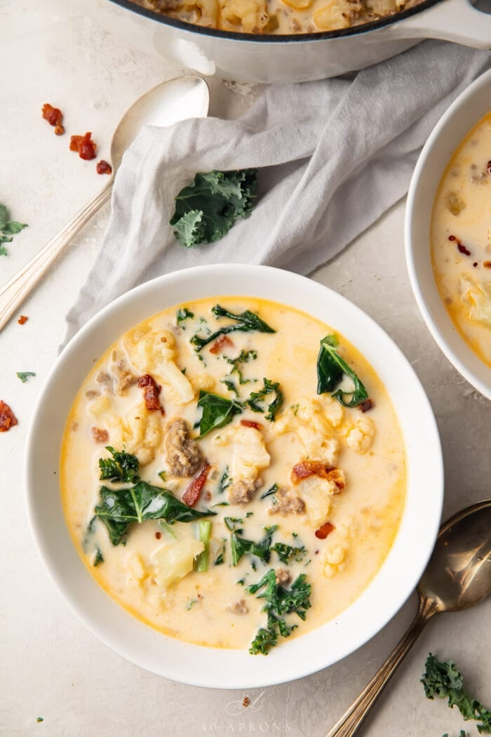 A bowl of keto zuppa toscana in a white ceramic bowl on a table